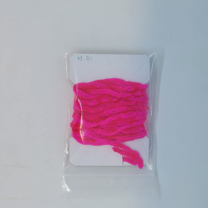 Chenille yarn bundle in hot pink, tightly looped in clear packaging