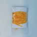 a package of gold chenille used in fly tying