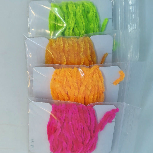 Chenille yarn bundle in lime green, orange, and hot pink, loosely looped in packaging