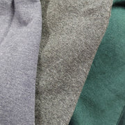 Hoodie sweatshirt fabric close-up with heather gray and green panel