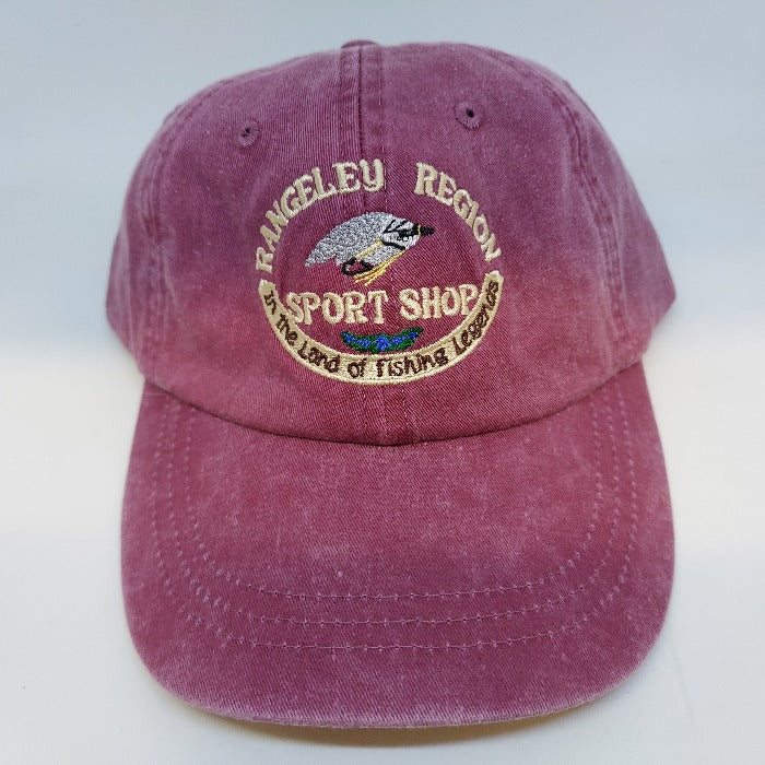 a cranberry colored hat with rangeley region sport shop logo