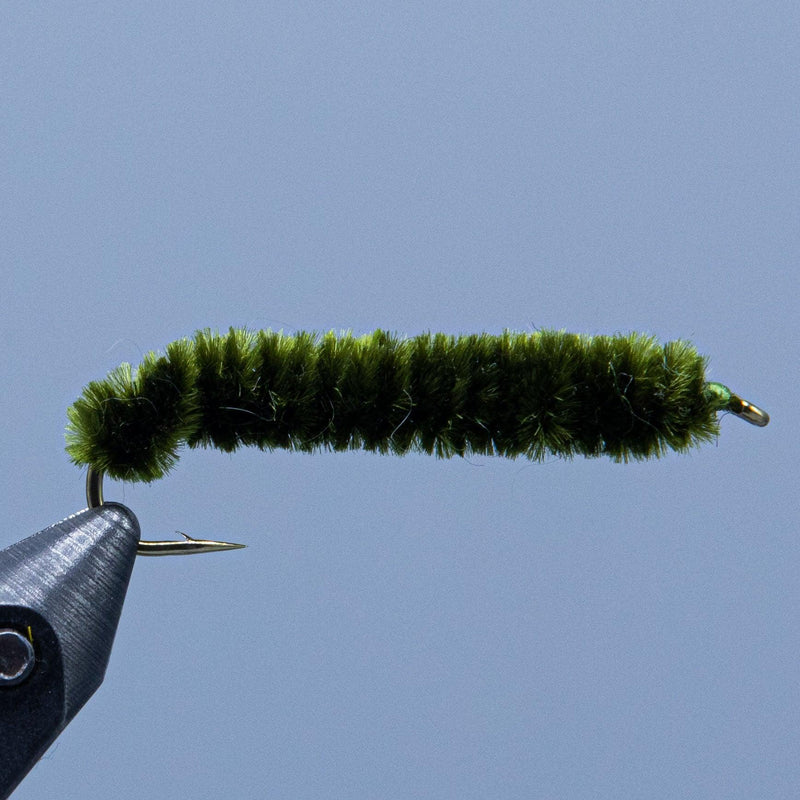 Green chenille fishing fly with feather-style tail on metal hook