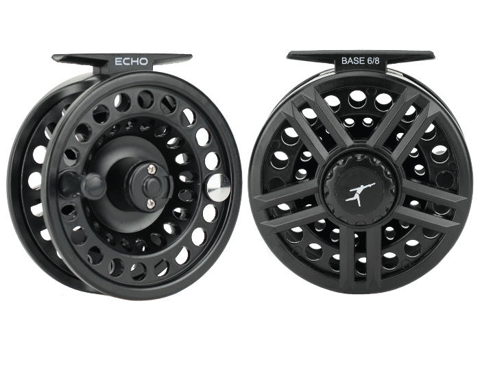 Black fishing reel with large perforated spool and handle, round side view