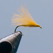 CDC caddis fly with light orange tan feather tail and shiny dark hook