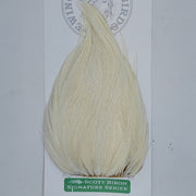 Pale cream feather hackle tuft with fine, straight barbs