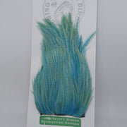 Teal blue feather hackle tuft with layered, spiky barbs