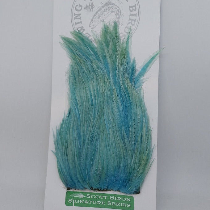 Teal blue feather hackle tuft with layered, spiky barbs