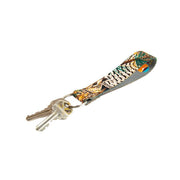 Key fob with multicolor animal-print strap and gold keyring, keys attached