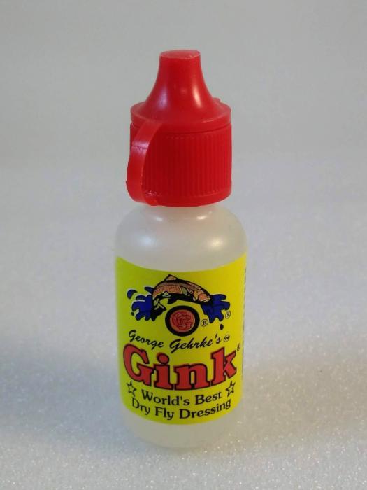 Gink dry fly dressing bottle with red flip-top cap, white body and colorful label