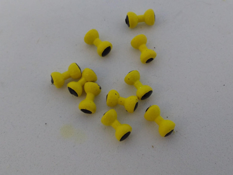 ten yellow dumbbell shaped "eyes" for tying fishing flies