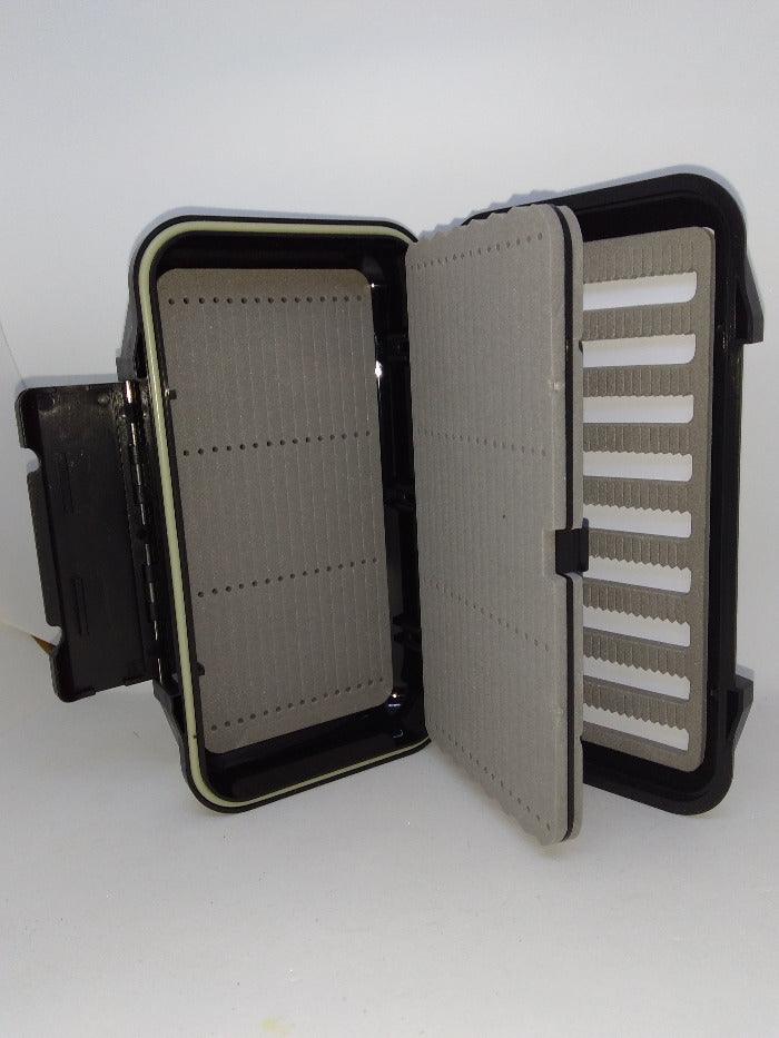 Dropper organizer case open, gray padded panels and divider strips, dark exterior