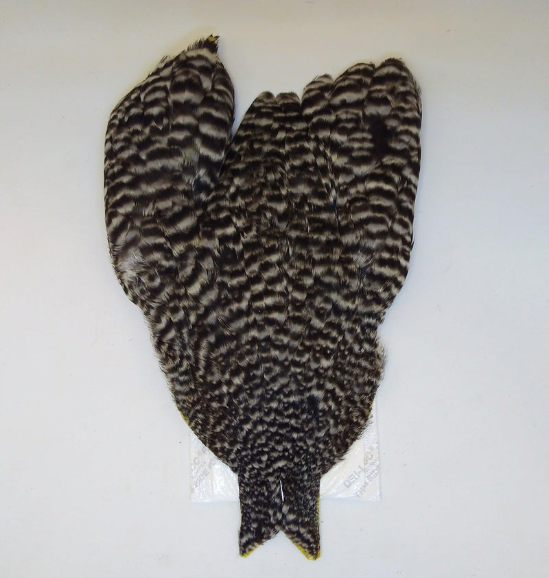 Whiting Farms hen cape, dark mottled striped fur with pointed tail
