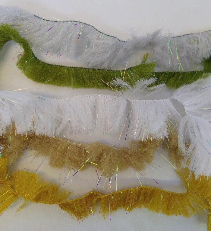 CCT body fur swatch with white base and green and gold fuzzy strands