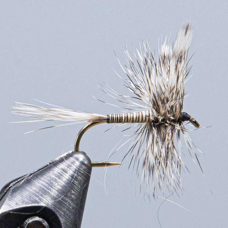 Feathered mosquito fishing fly lure on hook