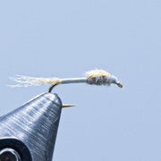 Fly fishing lure with grey ribbed body and pale wing
