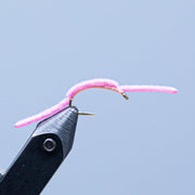 San Juan Worm fishing fly with pink fuzzy fibers and hook