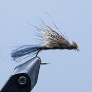 Caddis fishing fly with gray body and brown/cream hackle on dark hook