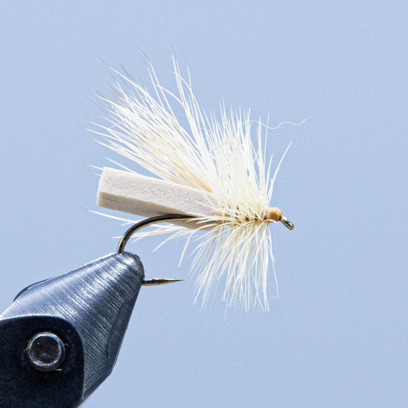 Cream caddis fly fishing lure with light body dubbing and white hackle