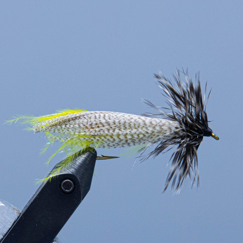 Red Tail Hornberg fishing fly with speckled body, neon yellow tail, black feather head