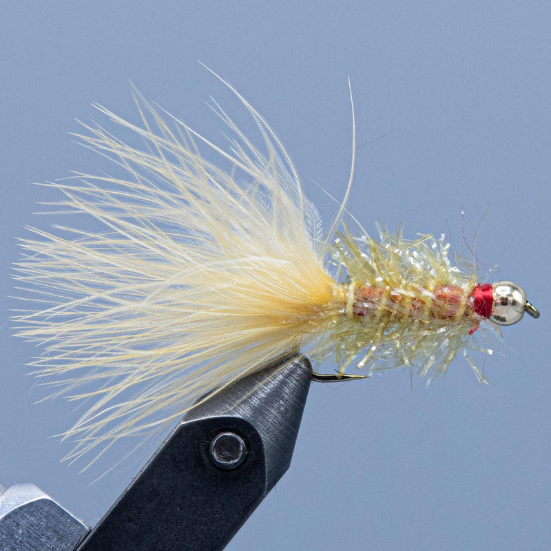 Golden Retriever fishing fly with pale yellow feather tail and red bead head