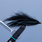 Double Bunny streamer fly lure with black fur and green thread wraps