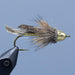 conehead muddler minnow with gold body and natural feathers and fur at a Rangeley maine fly shop