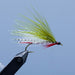 an olive and white  Dam wammy fishing fly from the maine fly shop