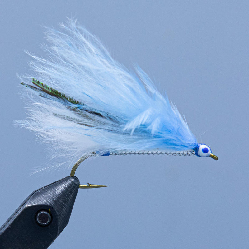 Blue marabou fishing fly with feather tail and bead head on hook