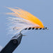 The Mansfield Marabou fishing fly is an orange and white winged streamer fishing fly with a black and silver body.  Tied for a Rangeley Maine Fly Shop