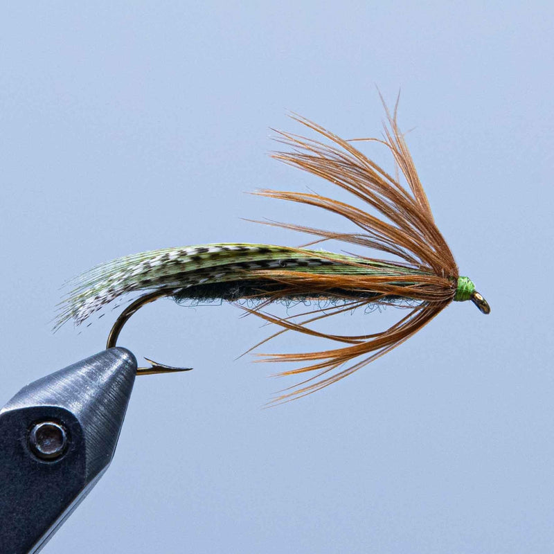 Teal and brown strip fishing fly with green bead head and soft hair tail
