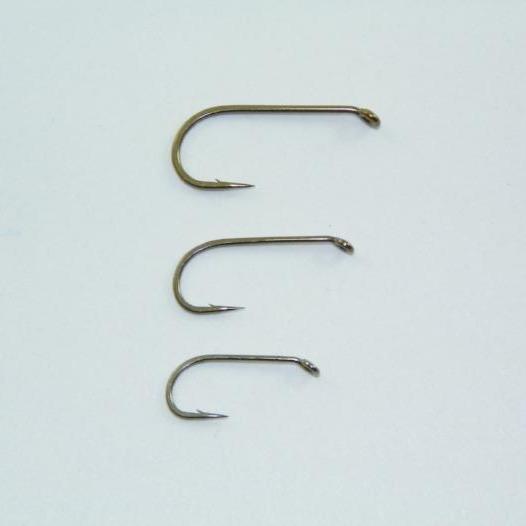 Mustad dry fly hooks with barbs, three shown