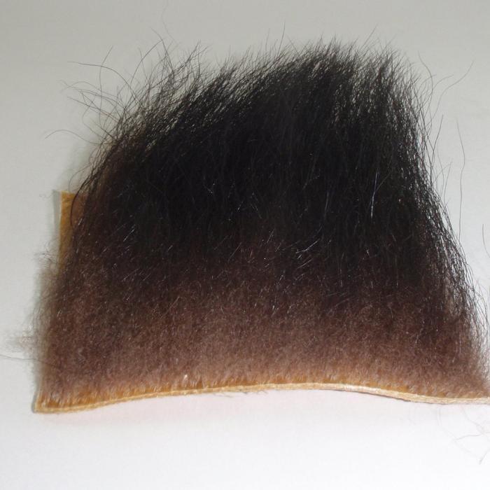 Black bear hair wig piece with dark brown-black hair, rounded top edge