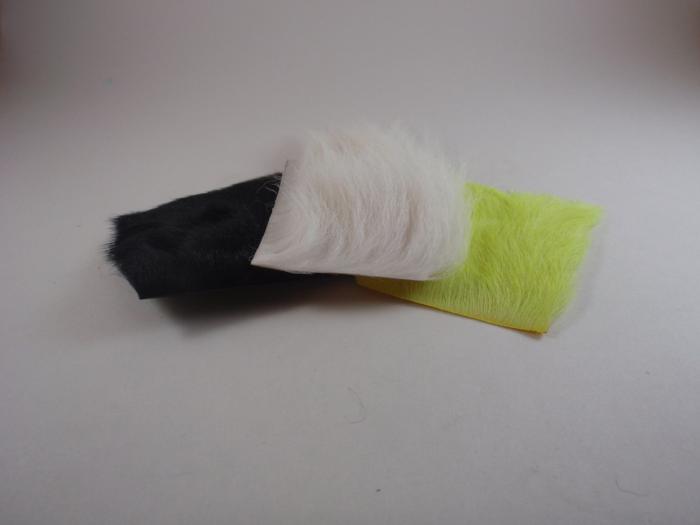 Wapsi calf body hair bundle in black, white, and fluorescent yellow