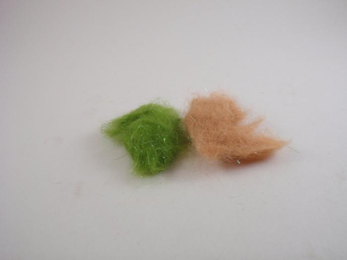 Tan and green dubbing fibers tuft