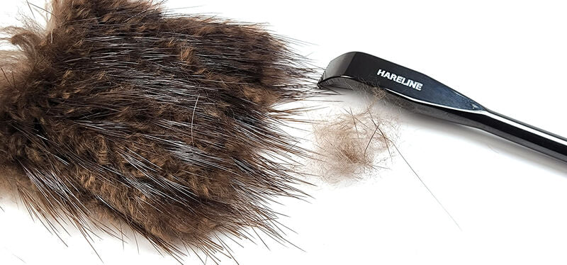 Hareline dubbing rake with metal comb head, shown with dark fur