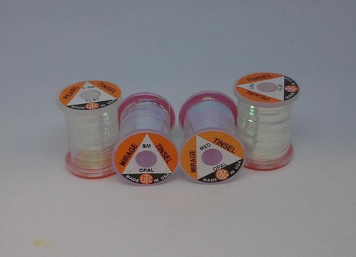 Iridescent tinsel thread spools in white with pink sheen