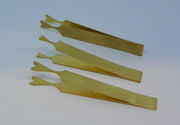 Fly wing burners, yellow-green plastic strips with wing-shaped ends