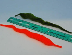 2 strips of "dragon tail" material next to a ruler to show the size