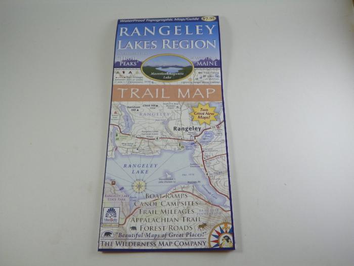 Rangeley Lakes Region trail map booklet, blue cover with printed route details