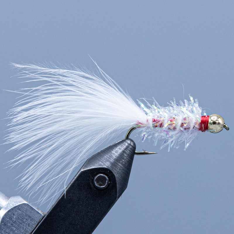 Fishing fly with white feather tail and red bead head, metal hook