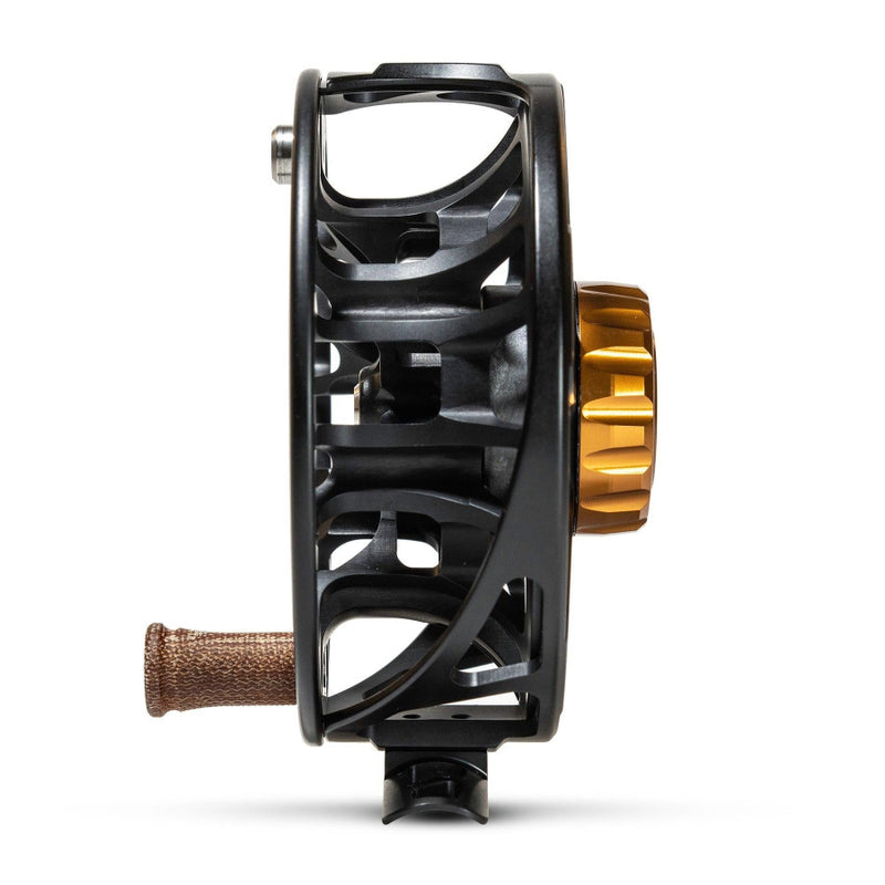 Fishing reel side view with black frame and gold spool detail