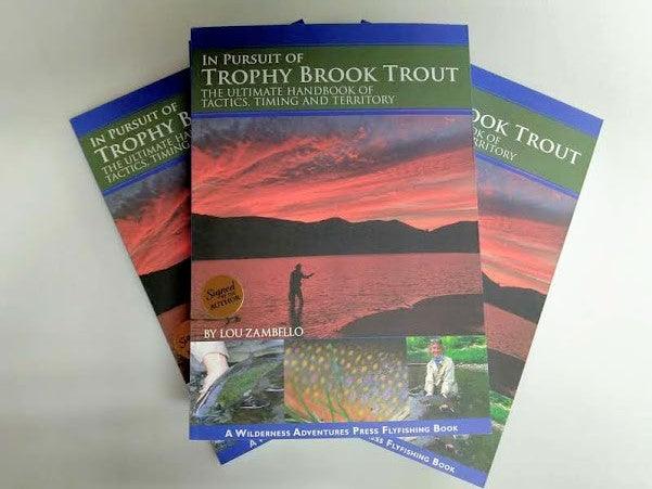 Fishing guide book with illustrated brook trout-themed cover; set of three books.