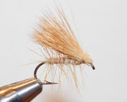 Deer hair caddis fly with tan hair wing and slim body, curved hook