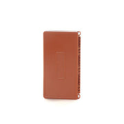 Tacky fly box closed, brown-orange hinged case with elastic strap loops