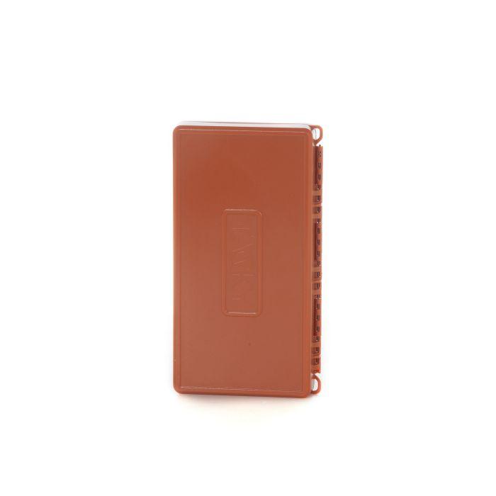 Tacky fly box closed, brown-orange hinged case with elastic strap loops