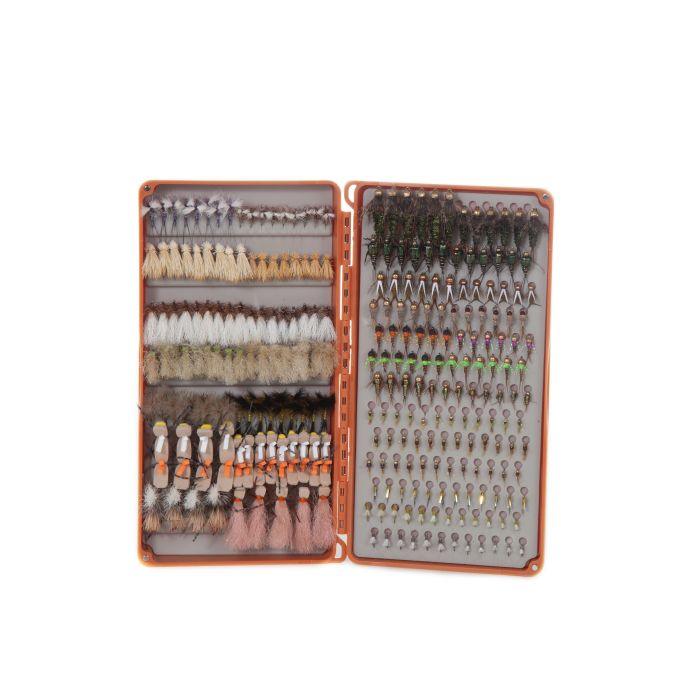 Fly box open showing compartment of mixed colorful fishing flies and hackles