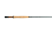 Fly rod with cork handle, dark green shaft, and black reel seat