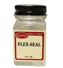 Wapsi Flex-Seal small clear jar with black lid and red-bordered label