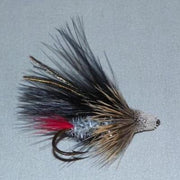 Feather muddler fly with black marabou wings, red accent tail, and small bead head