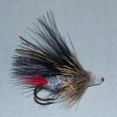 Feather muddler fly with black marabou wings, red accent tail, and small bead head